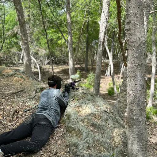 Customer playing paintball on the display