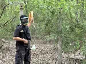 Paintball player holding a dirty rag.