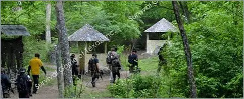Group of military men walking through the forest