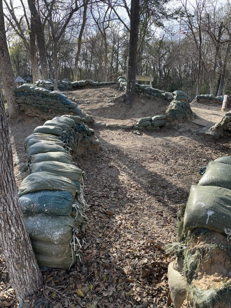 A panoramic view of players scattered across the massive outdoor paintball arenas at Survival Game of Texas.